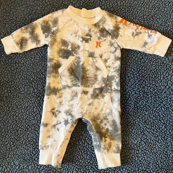 Grey and white Hurley baby one piece with orange accents. - Picture 1 of 6